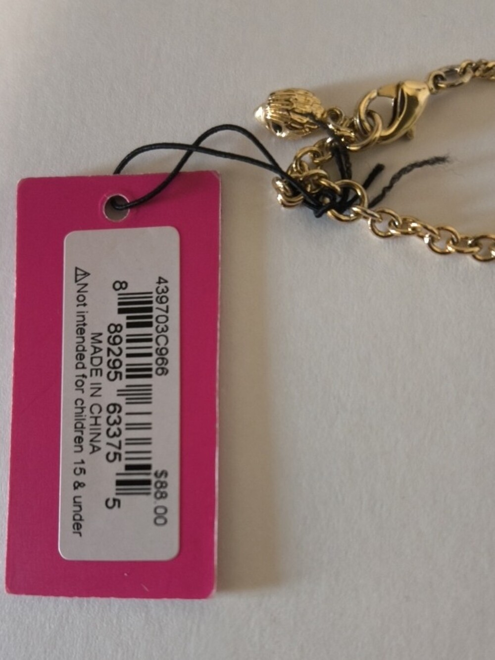 Kurt Geiger Gold Eagle HeadNecklace and Stud Earrings with Pink and Teal Pouches - Picture 4 of 6